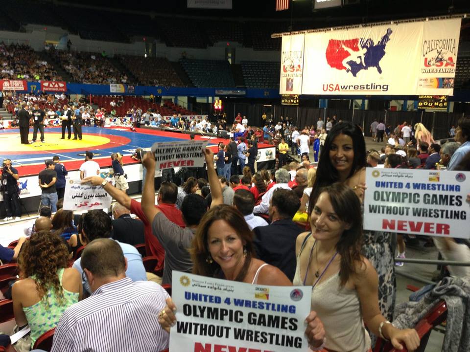 SportsTravel's Lisa Furfine, Nicole Goddeyne and Yvonne Garcia show their support for the sport of wrestling.
