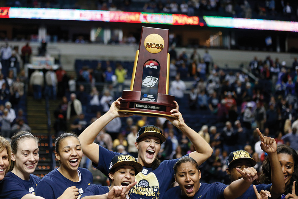 The University of Connecticut’s women’s basketball team won the NCAA Women’s Basketball Tournament in 2014, just days after the university’s men’s team took home the same prize in their tournament. Photo courtesy of John Bazemore/AP Images
