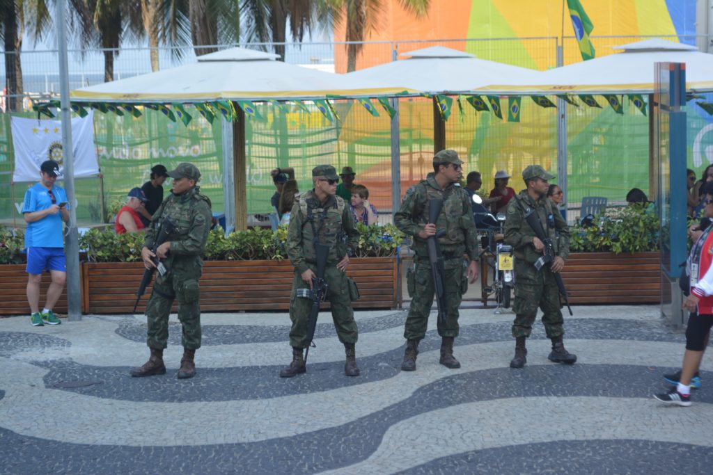 Soldiers stand guard outside the beach volleyball venue in Copacabana.