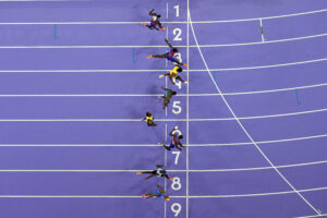 Noah Lyles, in lane seven, wins the men's 100-meter final at the 2024 Summer Olympics in Saint-Denis, France. (AP Photo/David J. Phillip)